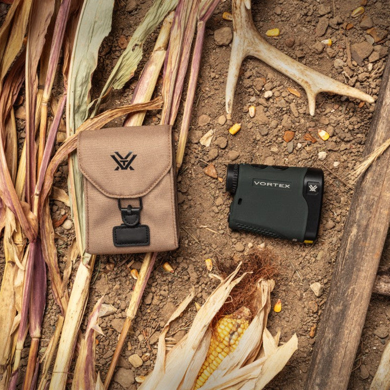 Vortex optics pouch and device on a natural setting with corn and antlers